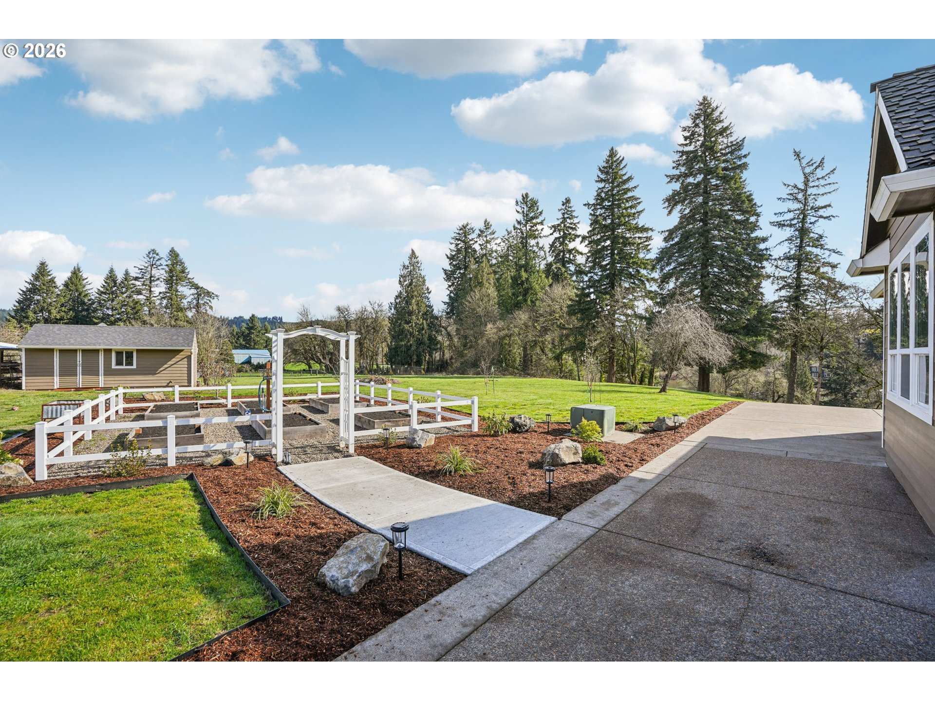 23044 Southwest Ulsky Road West Linn, OR 97068 - Photo 34 of 48 a view of a house with backyard porch and sitting area