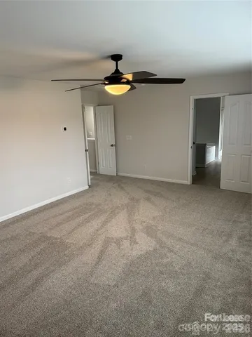 a room with a window and cabinet