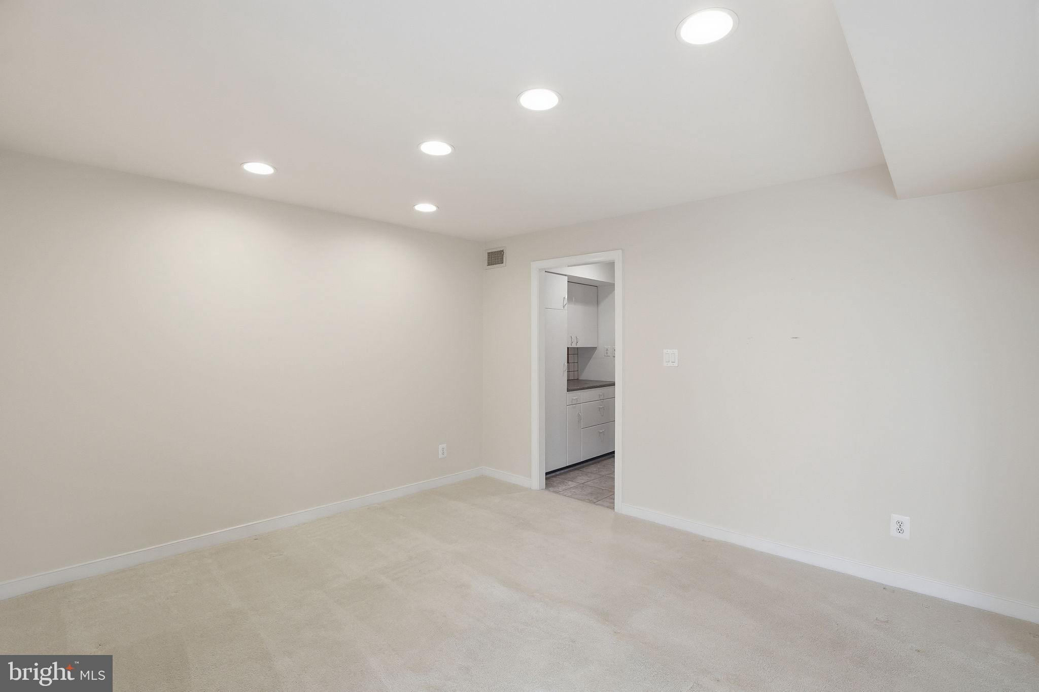 11400 Strand Drive, Unit R402 Rockville, MD 20852 - Photo 10 of 38 Kitchen access through dining room
