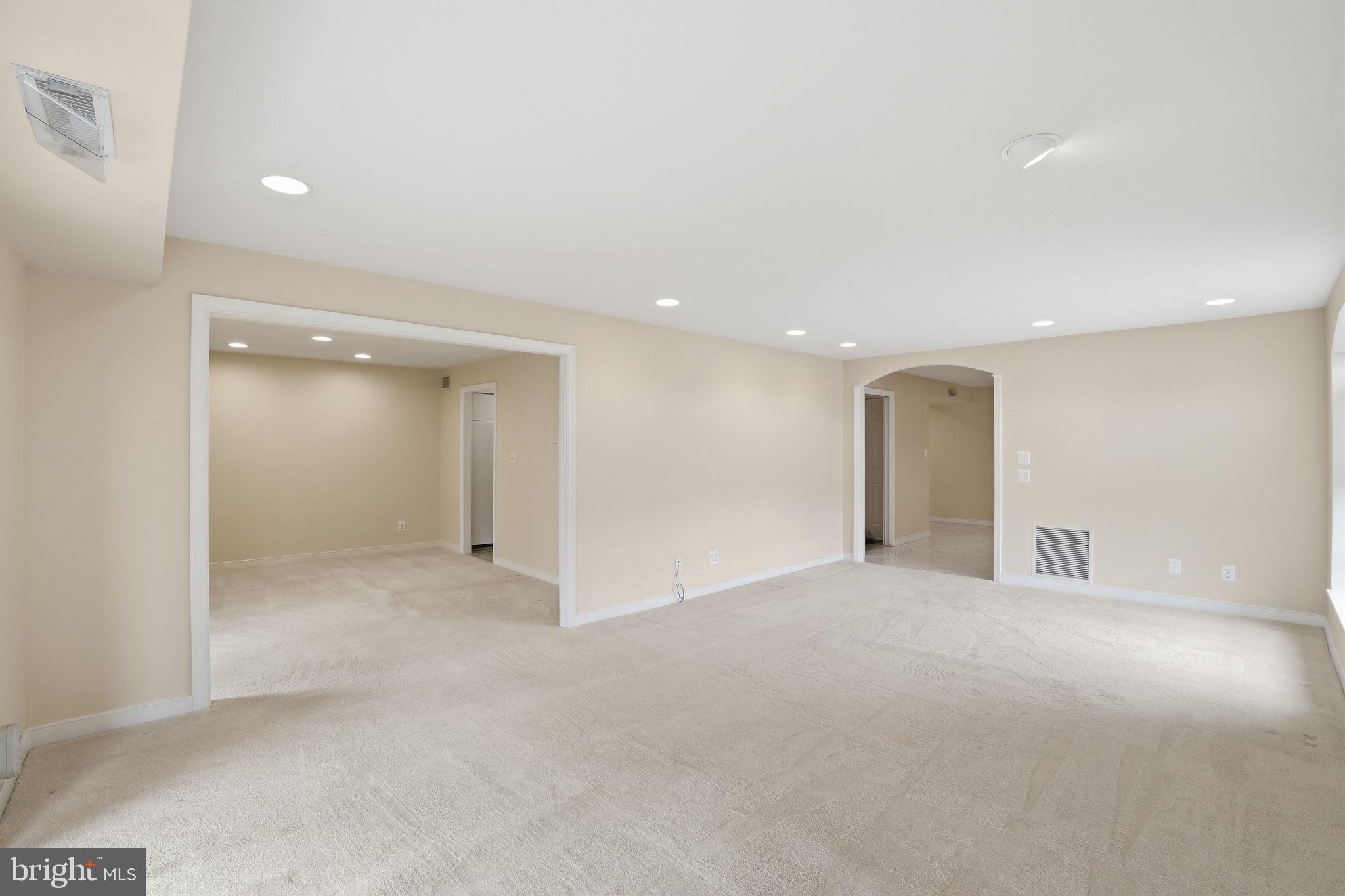 11400 Strand Drive, Unit R402 Rockville, MD 20852 - Photo 13 of 38 living room facing dining room and kitchen/foyer