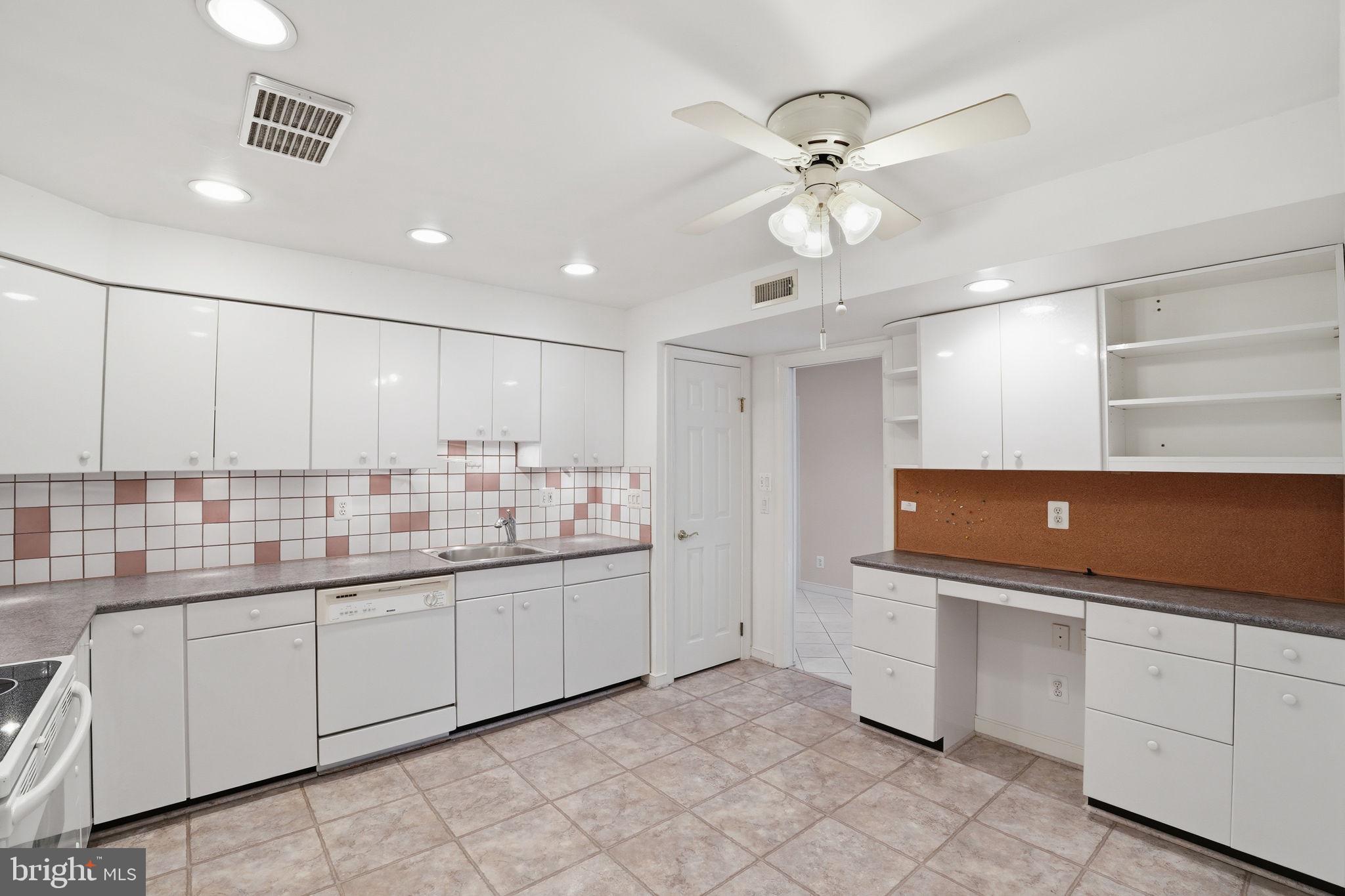 11400 Strand Drive, Unit R402 Rockville, MD 20852 - Photo 16 of 38 Kitchen entry back to Living room area