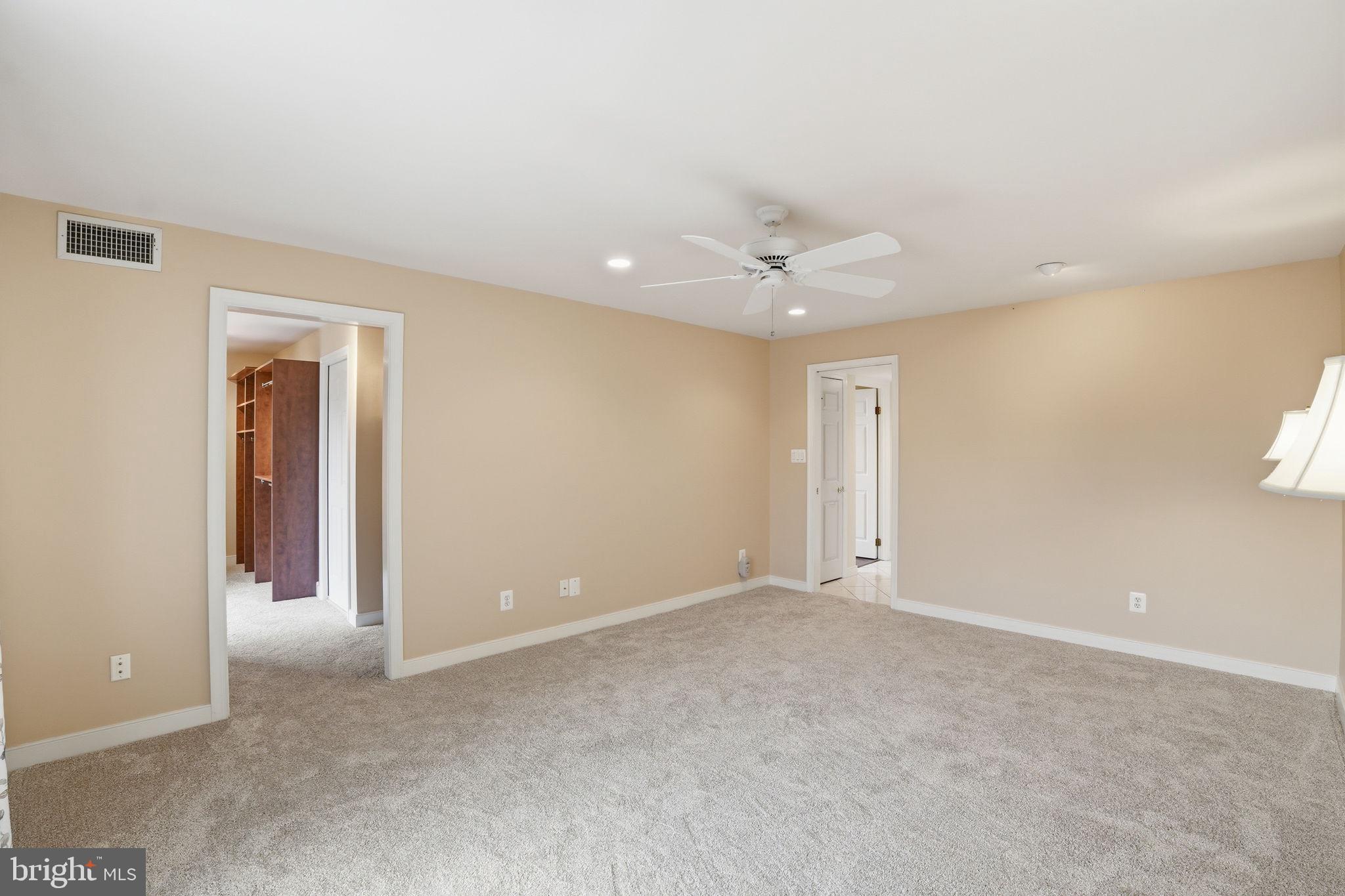 11400 Strand Drive, Unit R402 Rockville, MD 20852 - Photo 20 of 38 to walk in closet and primary bath