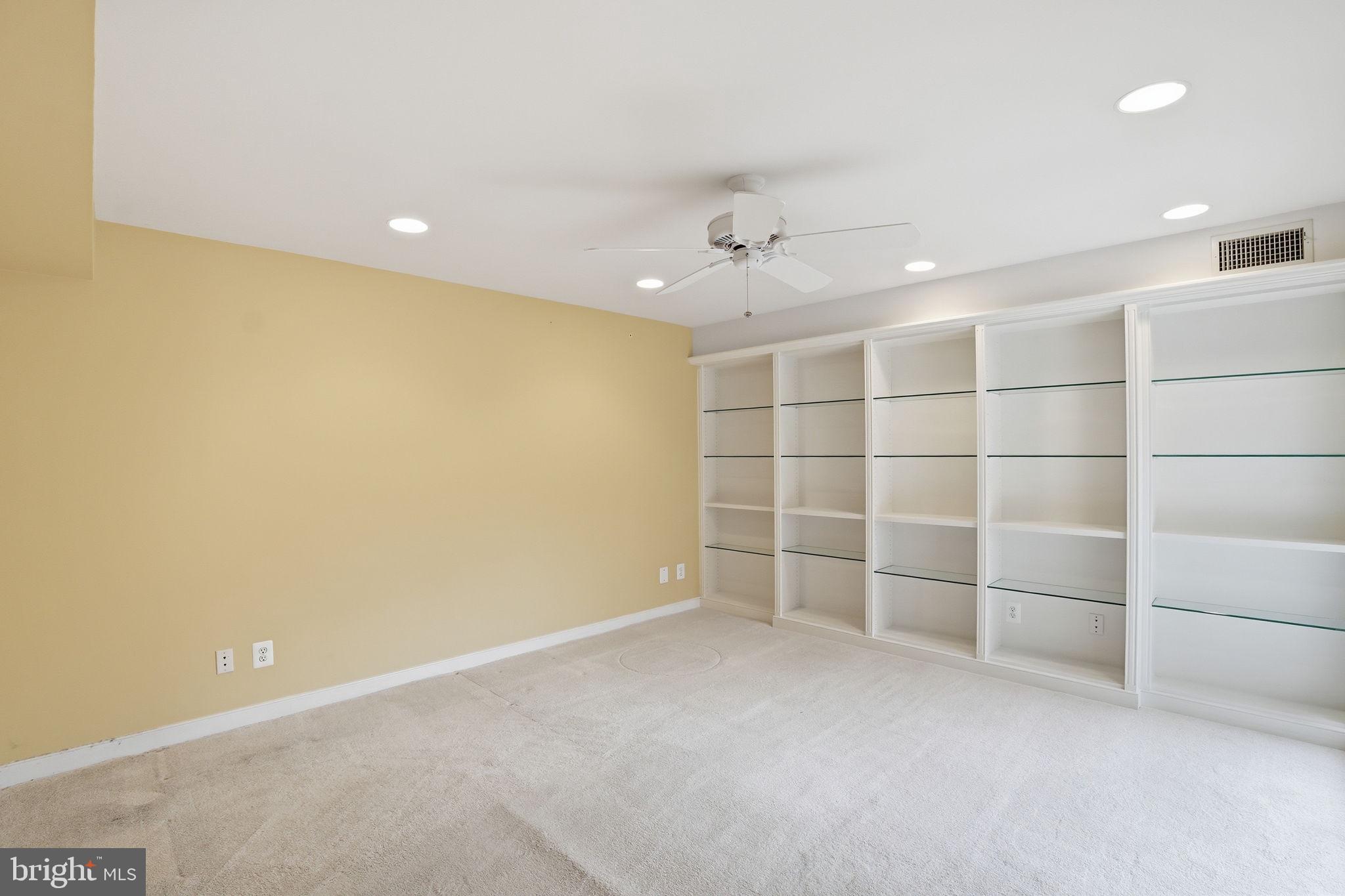 11400 Strand Drive, Unit R402 Rockville, MD 20852 - Photo 32 of 38 Den/Bedroom 3- custom shelving