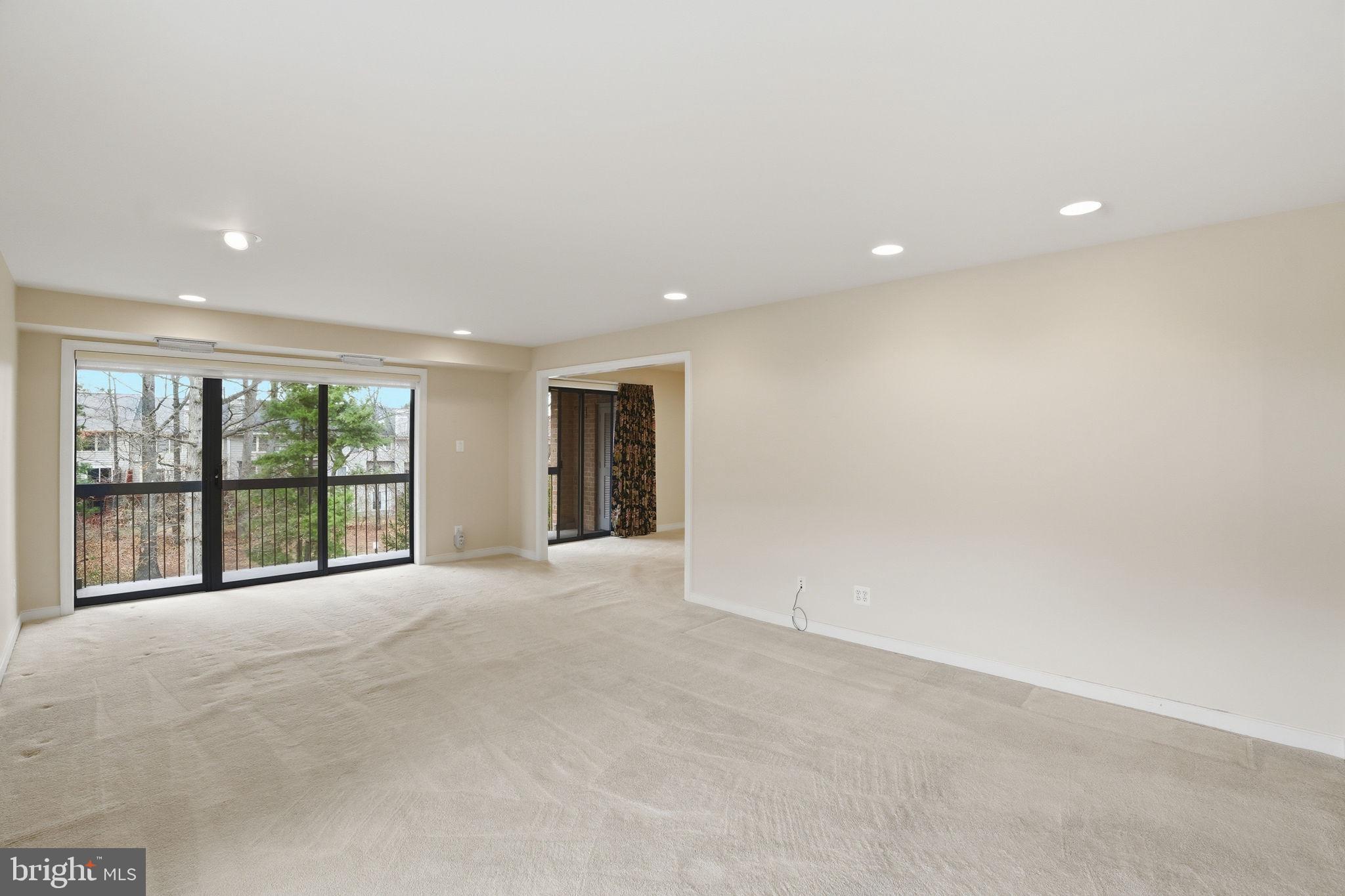 11400 Strand Drive, Unit R402 Rockville, MD 20852 - Photo 8 of 38 Slider door access to large private balcony