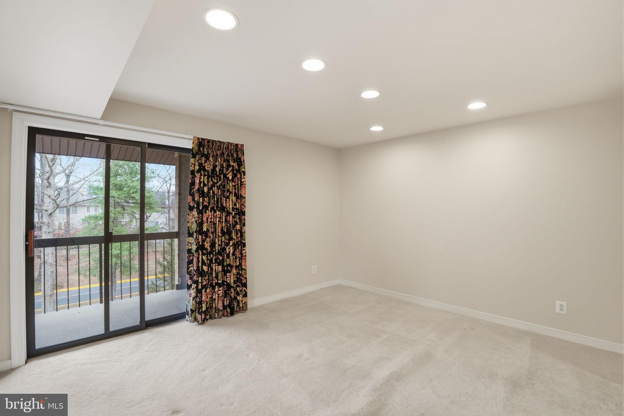11400 Strand Drive, Unit R402 Rockville, MD 20852 - Photo 9 of 38 Living room flows nicely to dining room