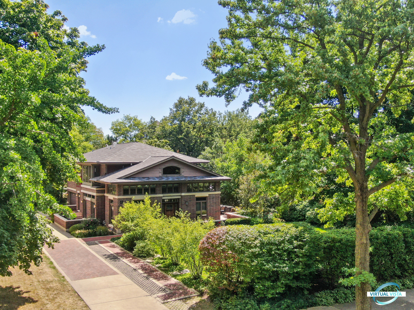 37 Longcommon Road Riverside, IL 60546 - Photo 2 of 34 a front view of a house with a garden