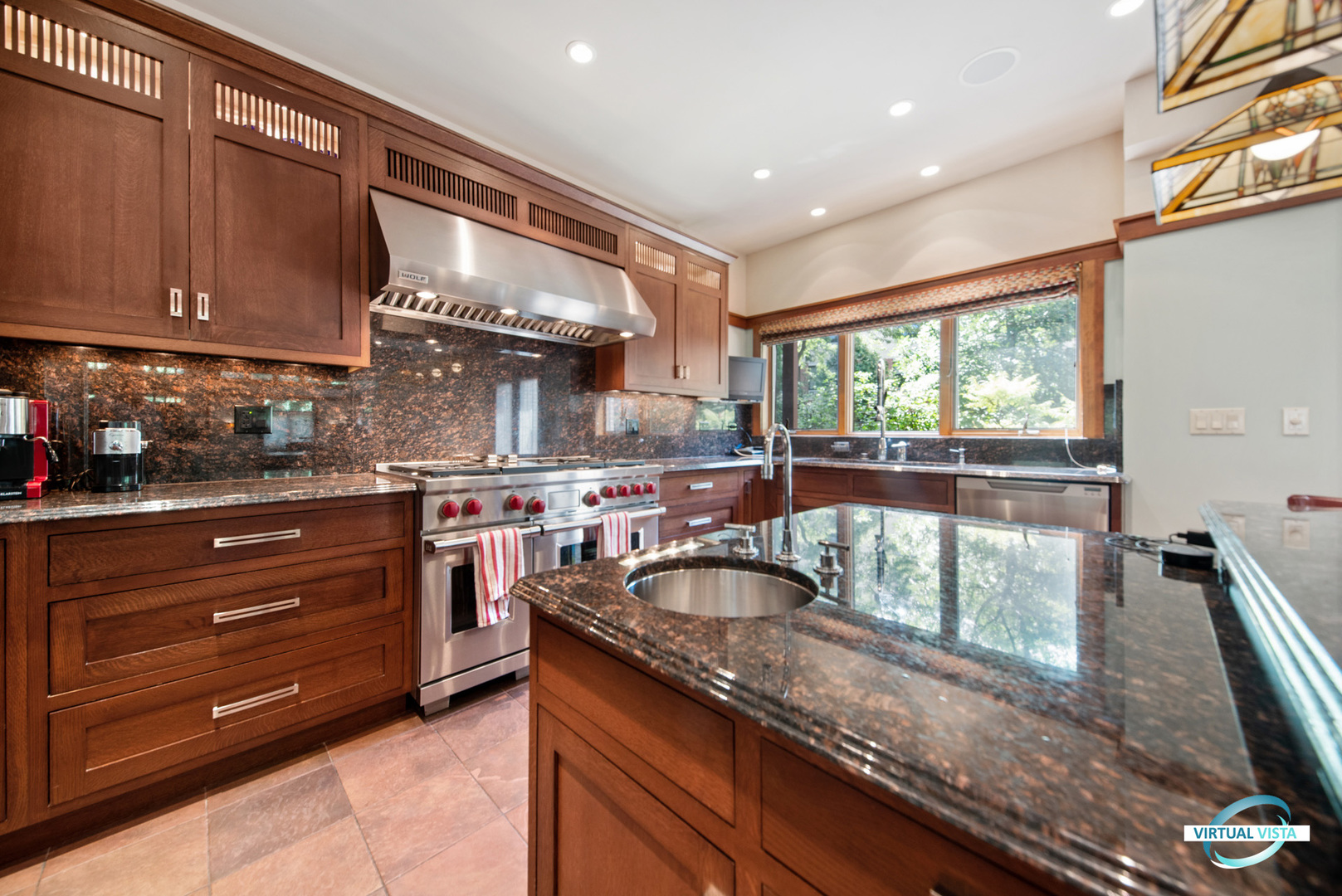 37 Longcommon Road Riverside, IL 60546 - Photo 15 of 34 a kitchen with a sink and wooden cabinets