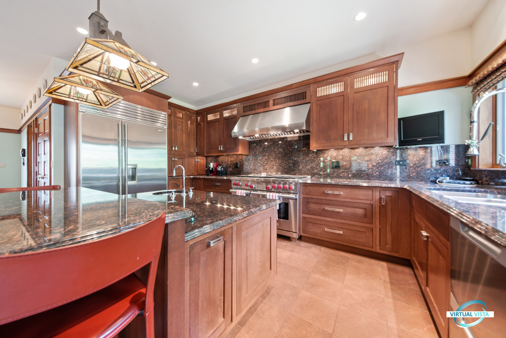 37 Longcommon Road Riverside, IL 60546 - Photo 16 of 34 a kitchen with stainless steel appliances kitchen island granite countertop a sink and cabinets