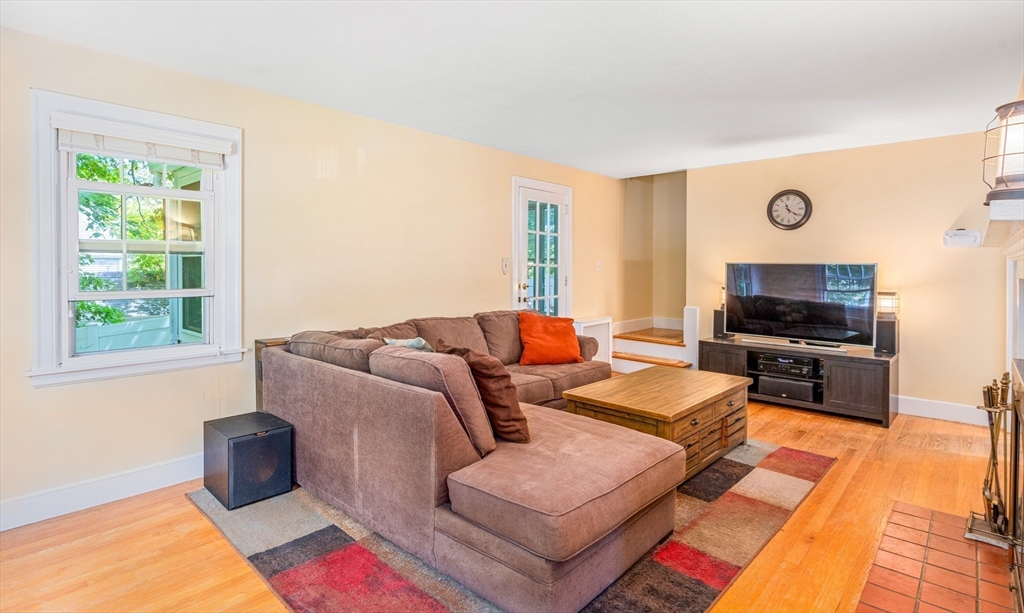 235 Emerson Street Springfield, MA 01118 - Photo 6 of 25 a living room with furniture and a flat screen tv