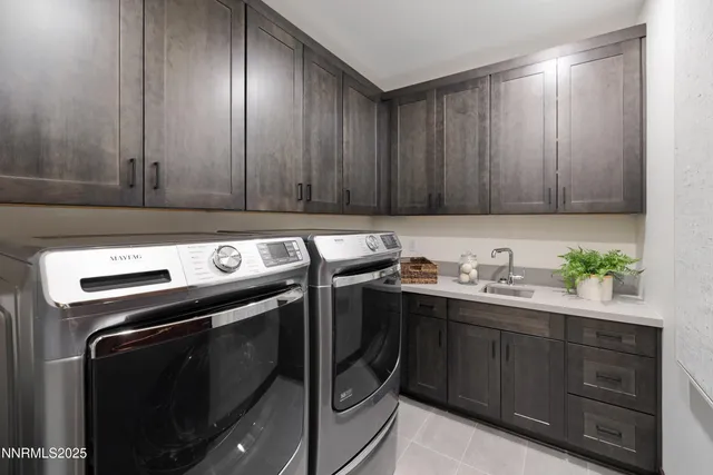 a kitchen with a sink a stove and cabinets