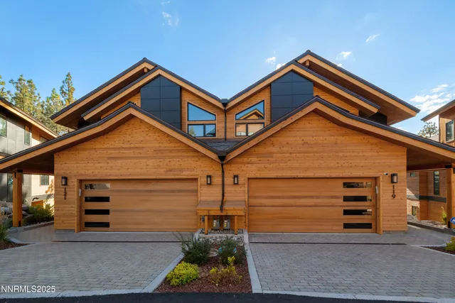a front view of a house with garage
