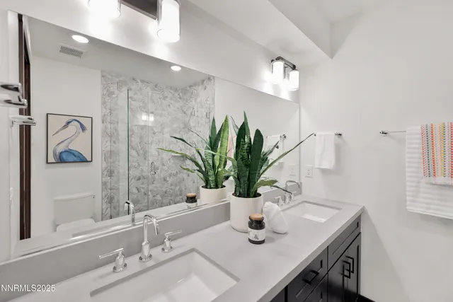 a bathroom with a sink a vanity and a mirror