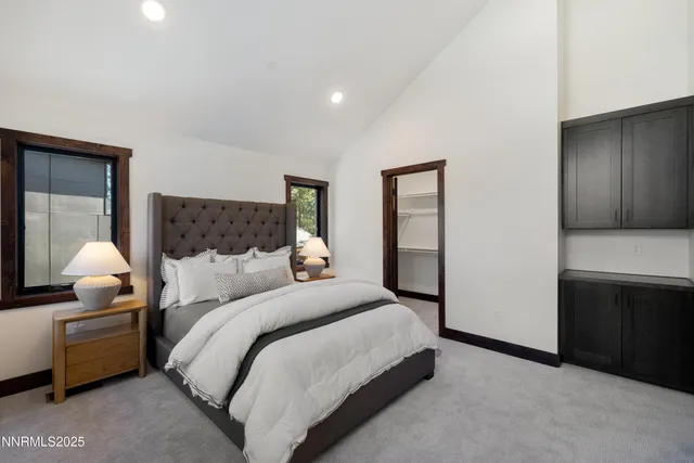 a bedroom with a bed and a lamp