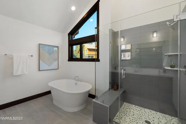 a bathroom with a toilet sink and shower