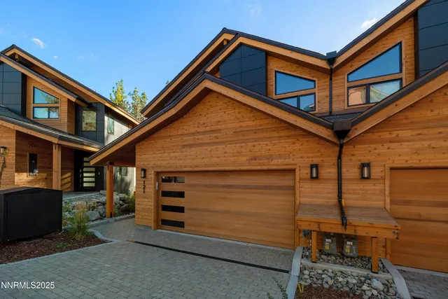 a front view of a house with garage
