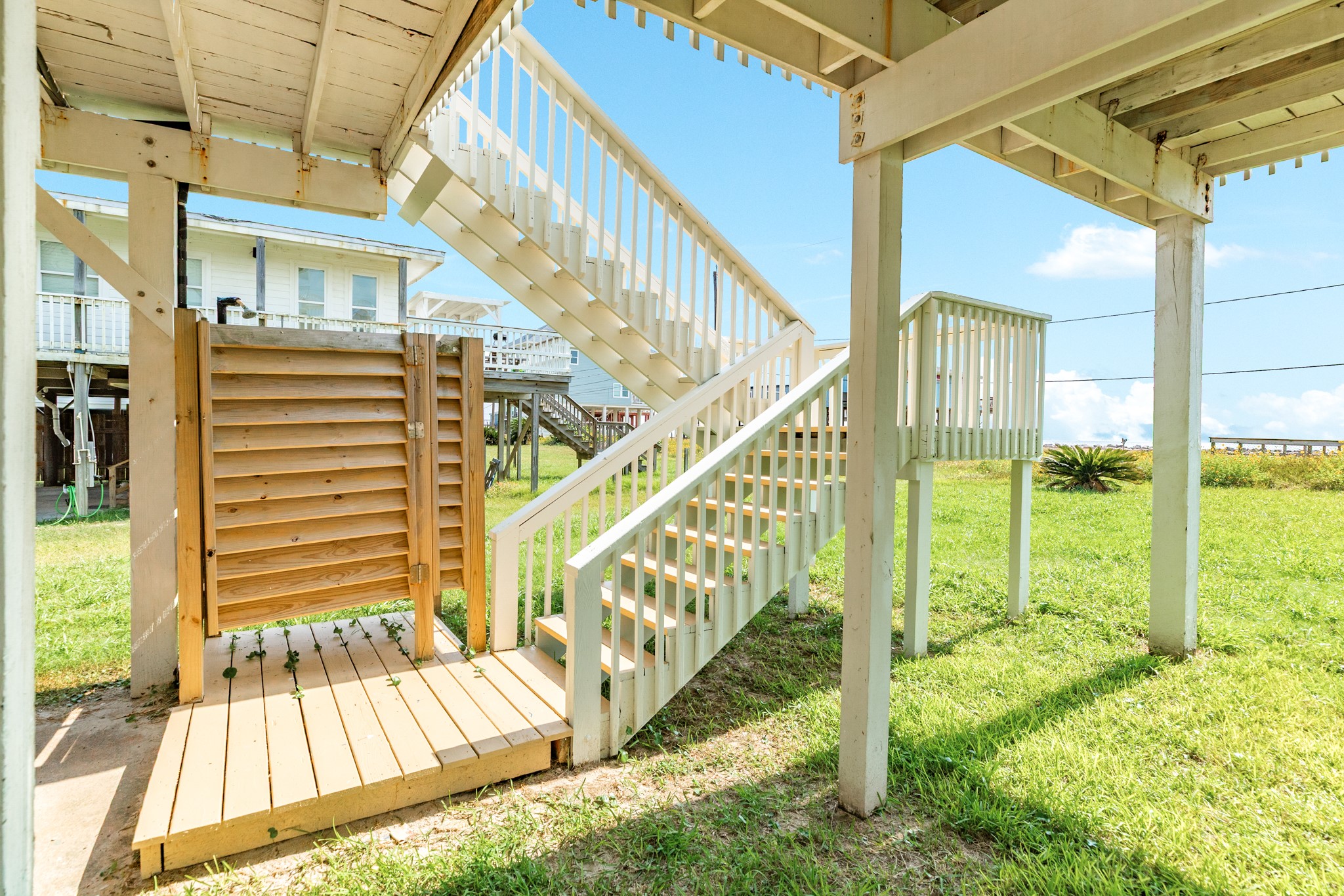 805 Seashell Drive Surfside Beach, TX 77541 - Photo 22 of 25 Outdoor shower behind the gate