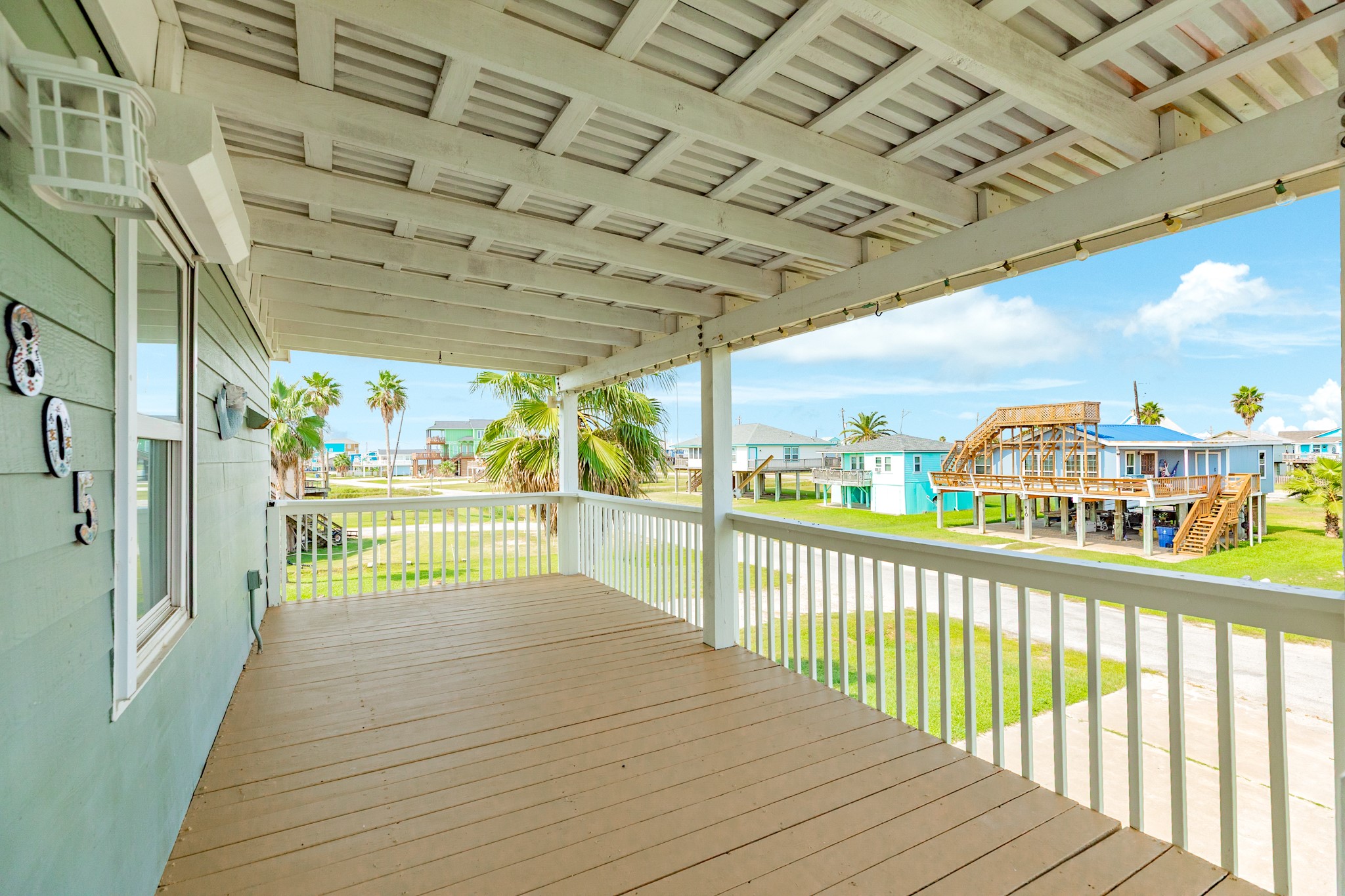 805 Seashell Drive Surfside Beach, TX 77541 - Photo 4 of 25 Friendly neighborhood views from the freshly painted porch