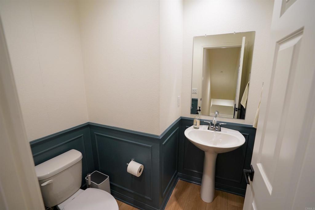 8375 Tahoe Street Lemon Grove, CA 91945 - Photo 13 of 27 a bathroom with a toilet sink and mirror