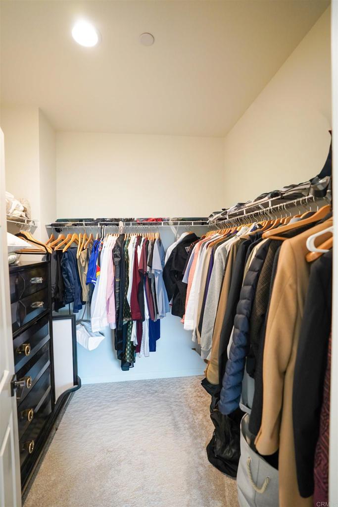 8375 Tahoe Street Lemon Grove, CA 91945 - Photo 18 of 27 a view of walk in closet with clothes and shoes