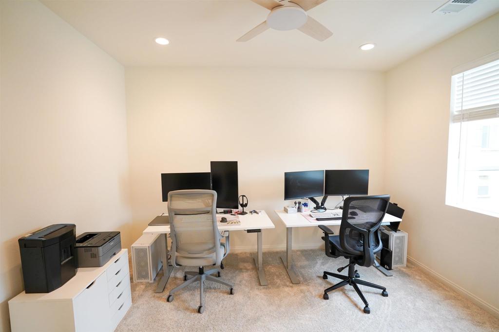 8375 Tahoe Street Lemon Grove, CA 91945 - Photo 19 of 27 a view of a workspace with furniture and a window