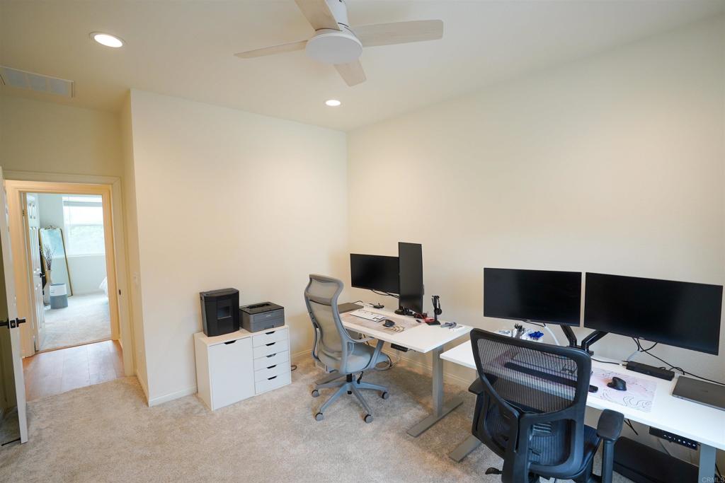 8375 Tahoe Street Lemon Grove, CA 91945 - Photo 20 of 27 a view of a workspace with a tv and a couch