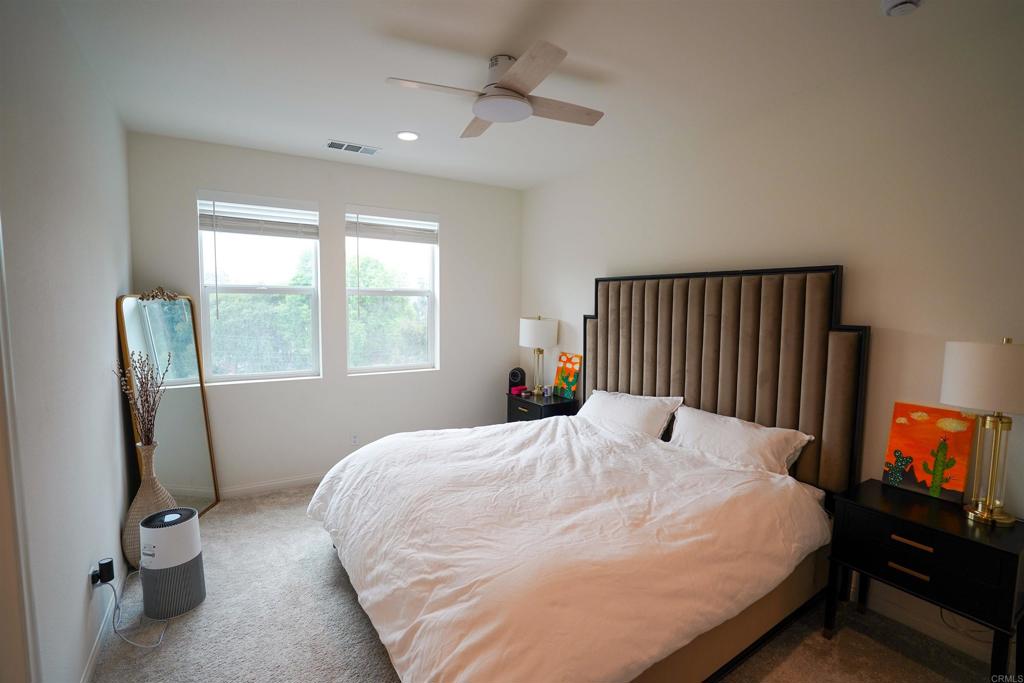 8375 Tahoe Street Lemon Grove, CA 91945 - Photo 7 of 27 a bed sitting in a bedroom next to a window