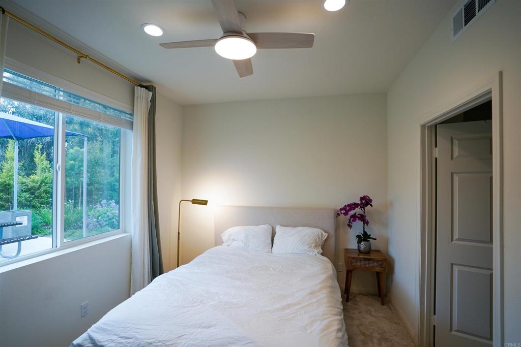 8375 Tahoe Street Lemon Grove, CA 91945 - Photo 8 of 27 a bedroom with a bed and a large window