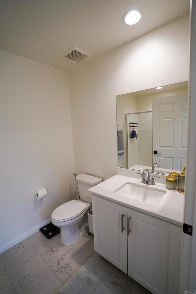 8375 Tahoe Street Lemon Grove, CA 91945 - Photo 10 of 27 a bathroom with a sink toilet and mirror