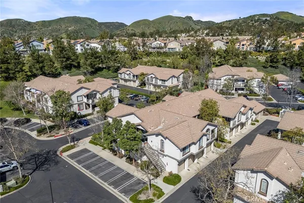 an aerial view of residential houses with outdoor space