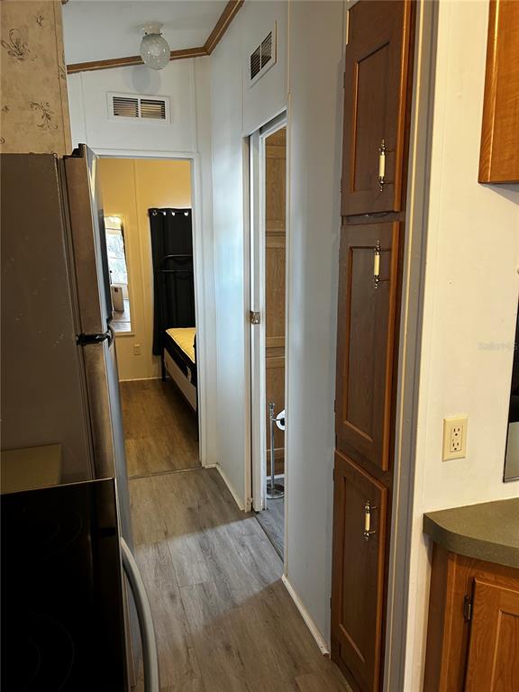 6946 Old Pasco Road, Unit LOT 1 Wesley Chapel, FL 33544 - Photo 12 of 16 a view of a kitchen from the hallway
