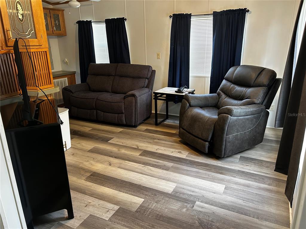 6946 Old Pasco Road, Unit LOT 1 Wesley Chapel, FL 33544 - Photo 3 of 16 a living room with furniture and a couch