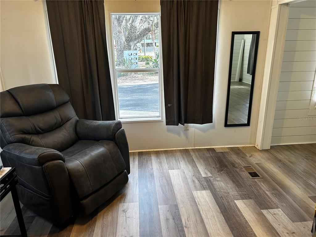 6946 Old Pasco Road, Unit LOT 1 Wesley Chapel, FL 33544 - Photo 4 of 16 a living room with furniture and a window