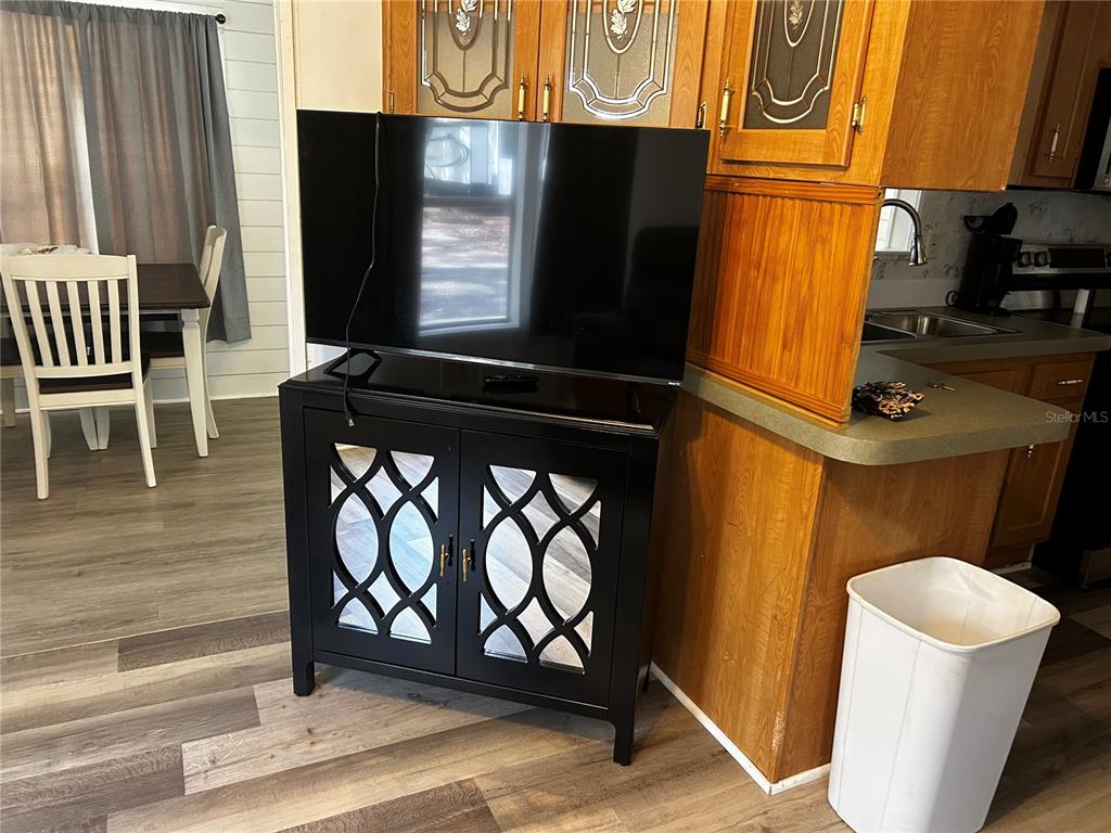 6946 Old Pasco Road, Unit LOT 1 Wesley Chapel, FL 33544 - Photo 6 of 16 a view of an empty room with a window and wooden floor