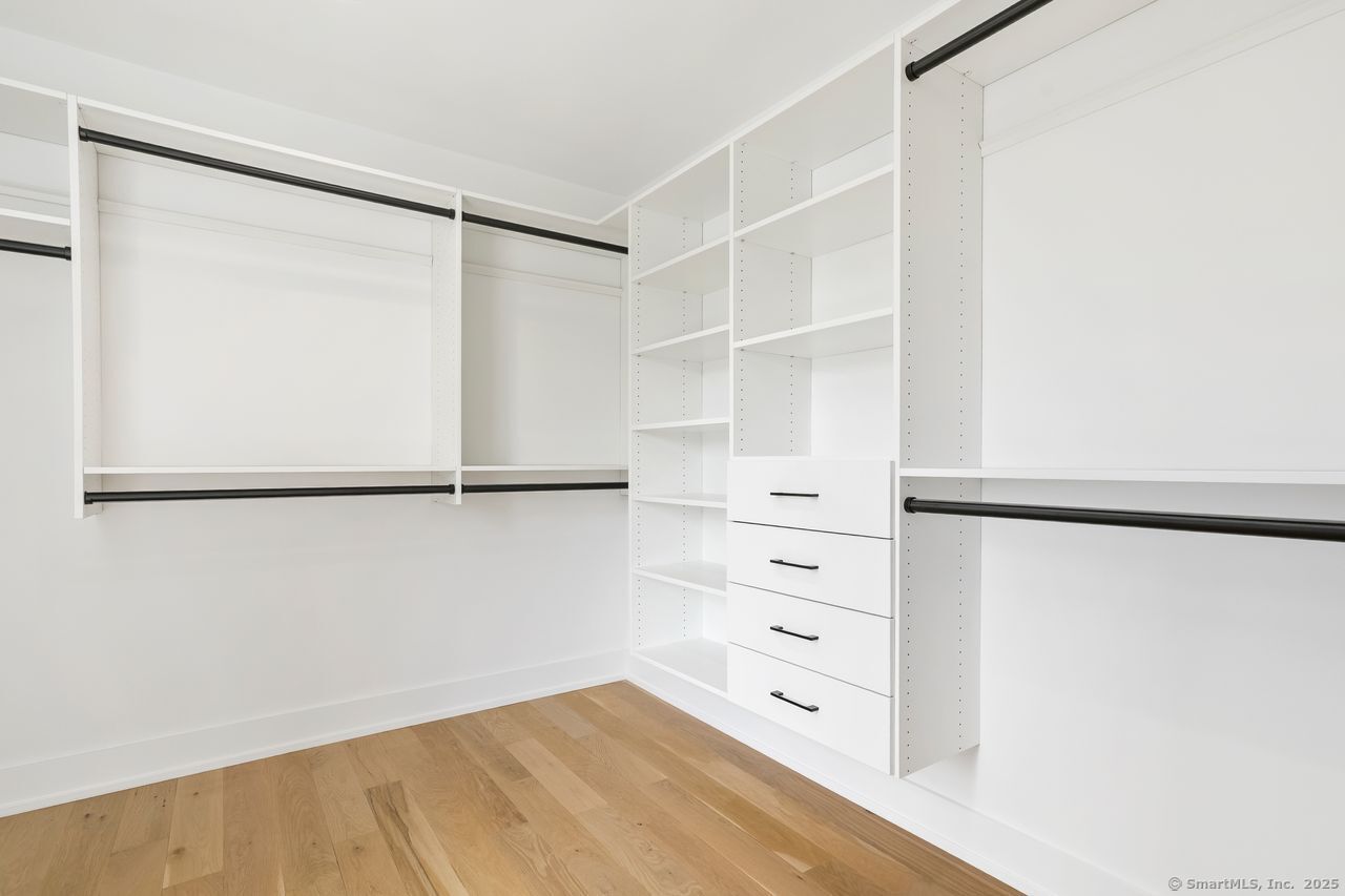 345 Reef Road, Unit B6 Fairfield, CT 06824 - Photo 22 of 40 a view of walk in closet with empty racks