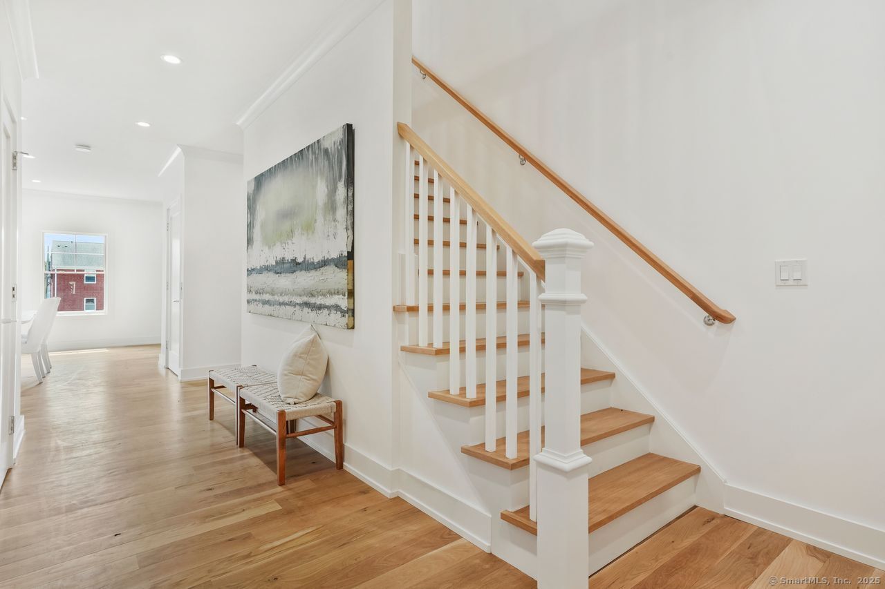 345 Reef Road, Unit B6 Fairfield, CT 06824 - Photo 4 of 40 a view of entryway and hall with wooden floor