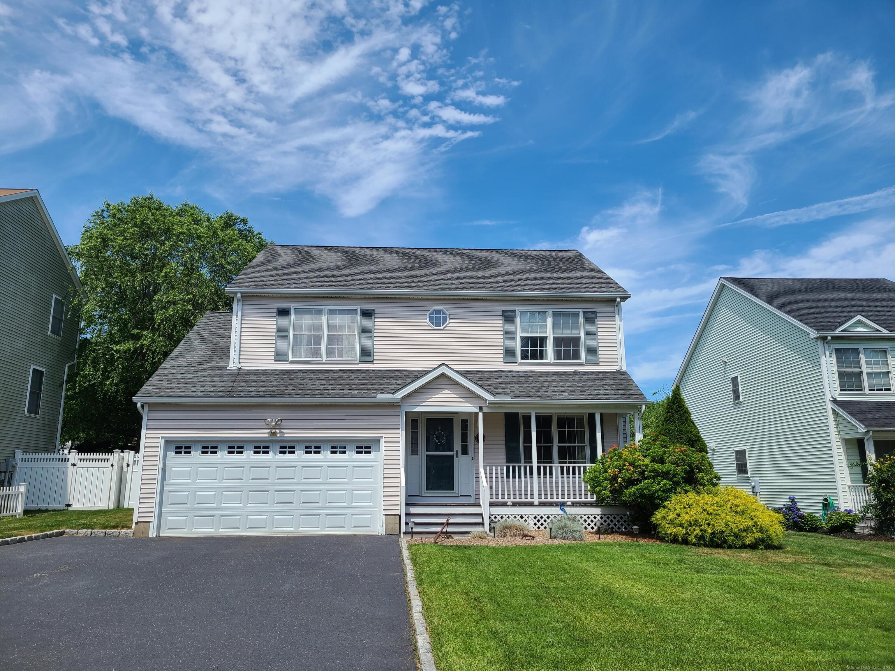 95 Baxter Street Stratford, CT 06615 - Photo 1 of 1 a front view of a house with a garden and plants