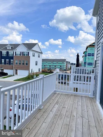 a white toilet sitting next to a bathroom sink and vanity