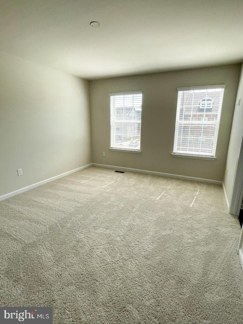 7066 Delegate Place Frederick, MD 21703 - Photo 17 of 25 an empty room with windows