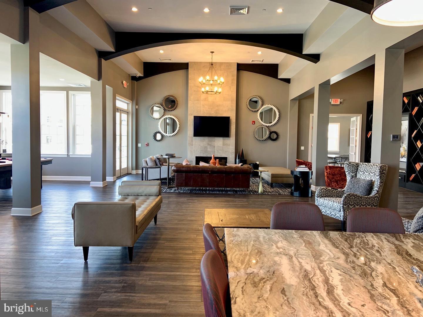7066 Delegate Place Frederick, MD 21703 - Photo 23 of 25 a living room with furniture and a large mirror