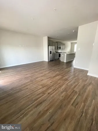 a view of kitchen with wooden floor