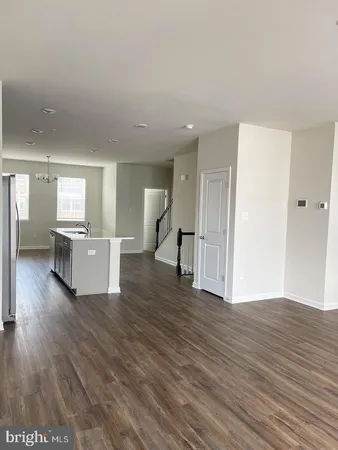 a kitchen with stainless steel appliances a refrigerator sink and microwave