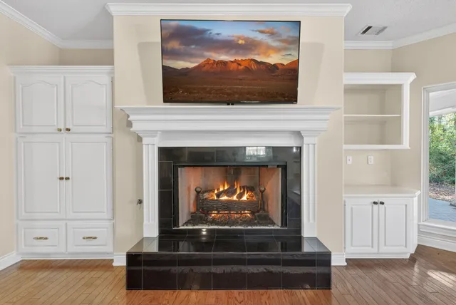 a view of a kitchen with cabinets and staircase