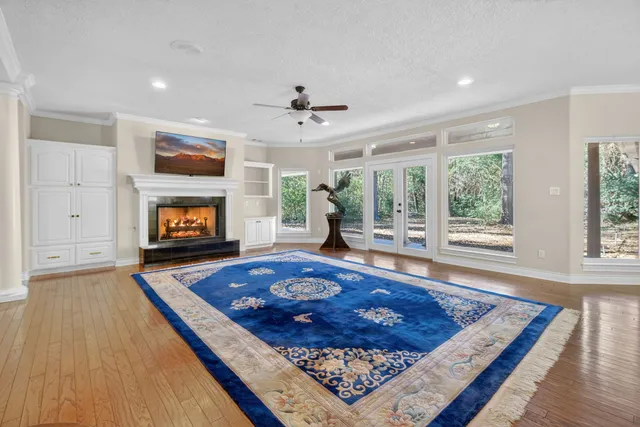 a living room with a flat screen tv and a fireplace