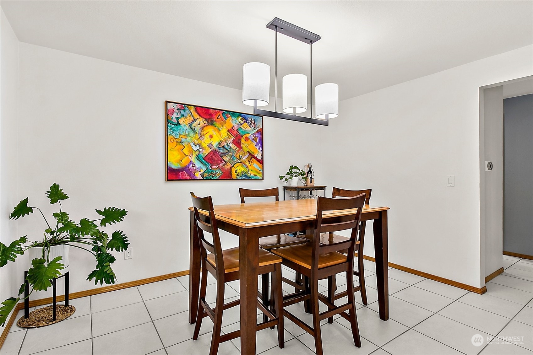 11008 Southeast 183rd Place Renton, WA 98055 - Photo 3 of 30 a dining room with furniture and wooden floor