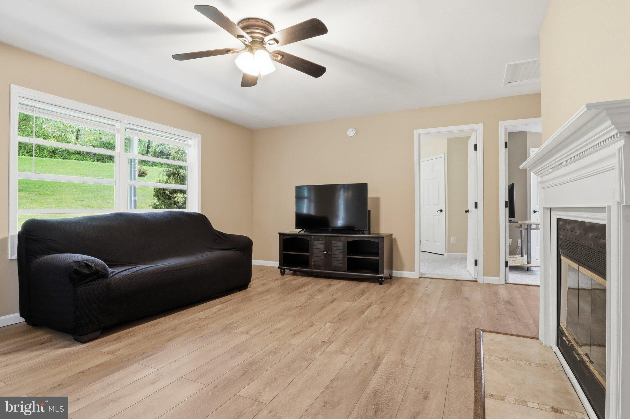 491 Garvine Mill Road Fawn Grove, PA 17321 - Photo 6 of 47 a living room with furniture and a flat screen tv
