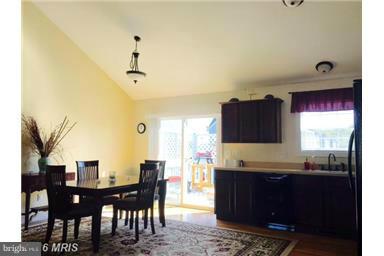 28 Job Road Inwood, WV 25428 - Photo 5 of 15 a living room with kitchen island furniture and a window