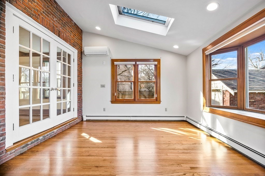8 Parker Road Winchester, MA 01890 - Photo 12 of 37 a view of an empty room with wooden floor and a window