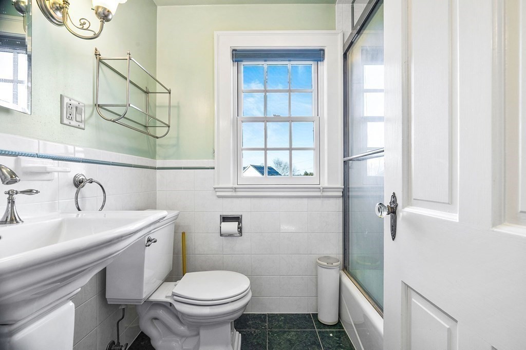 8 Parker Road Winchester, MA 01890 - Photo 25 of 37 a bathroom with a sink a toilet and a mirror