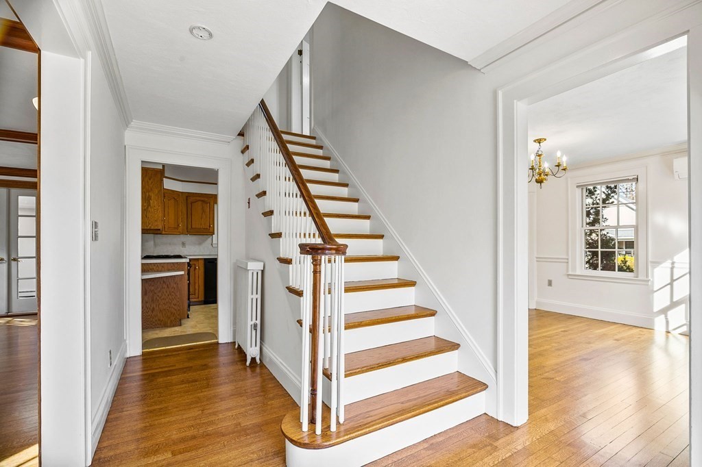 8 Parker Road Winchester, MA 01890 - Photo 4 of 37 a view of a hallway with wooden floor and entryway