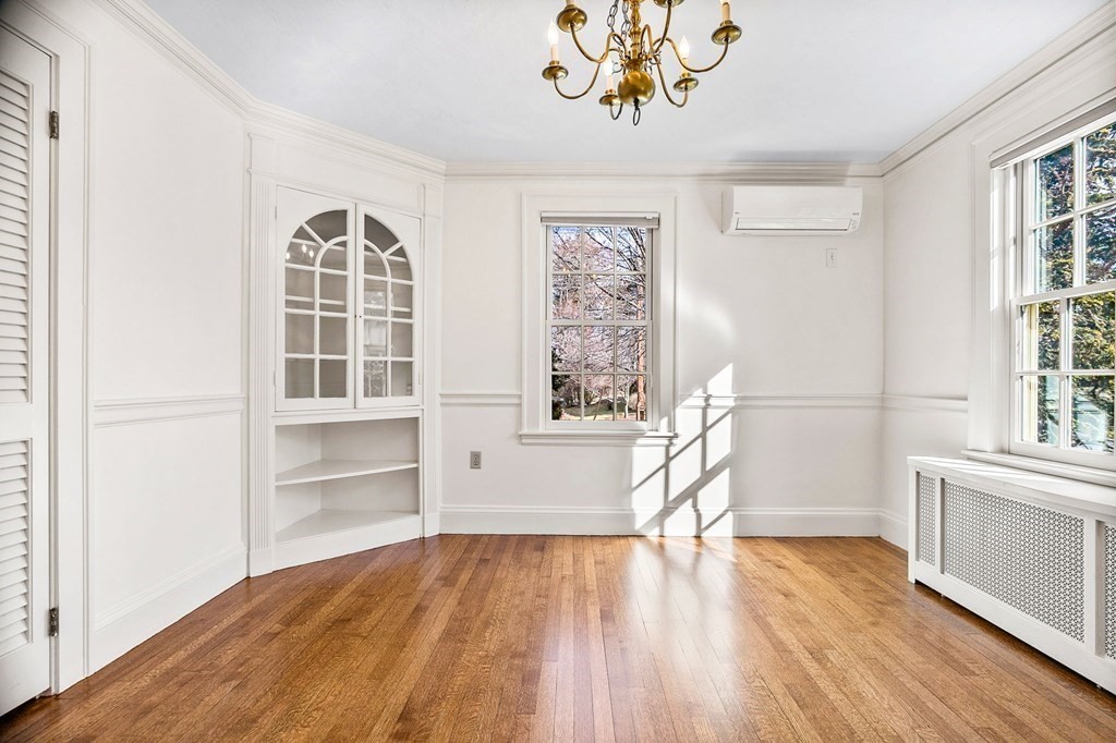 8 Parker Road Winchester, MA 01890 - Photo 6 of 37 wooden floor in an empty room with a window